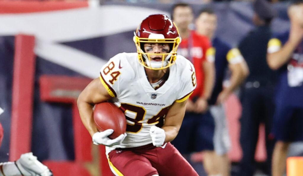 Dax Milne #15 of the Washington Commanders warms up prior to the game against the Minnesota Vikings at FedExField