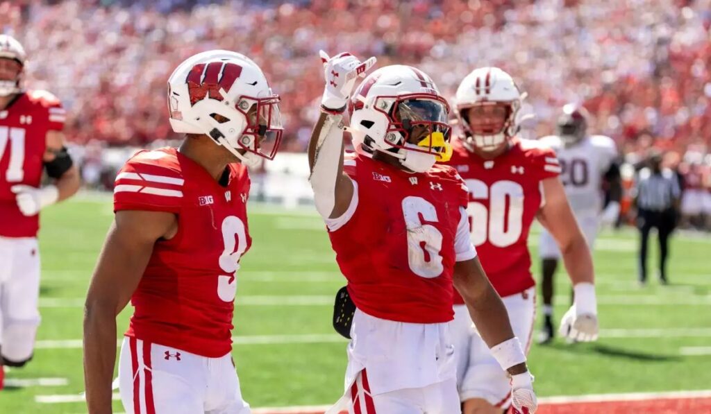 Wisconsin quarterback orchestrates an impressive passing game, leading the team to a commanding 52-6 victory against Purdue