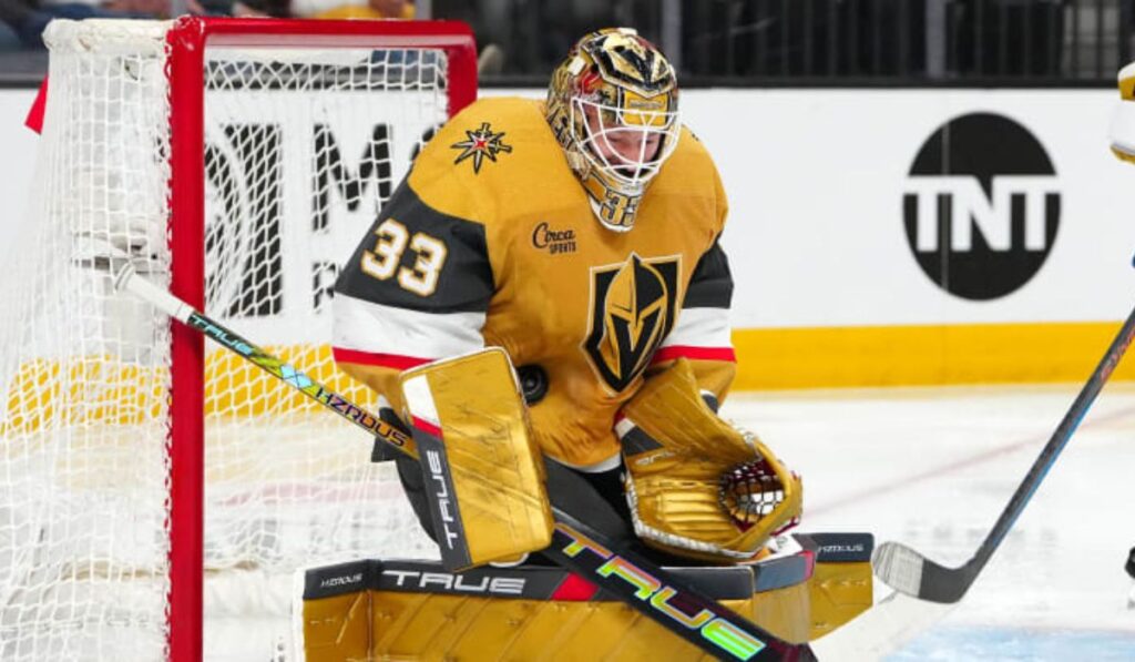 Vegas Golden Knights players celebrating a goal on ice