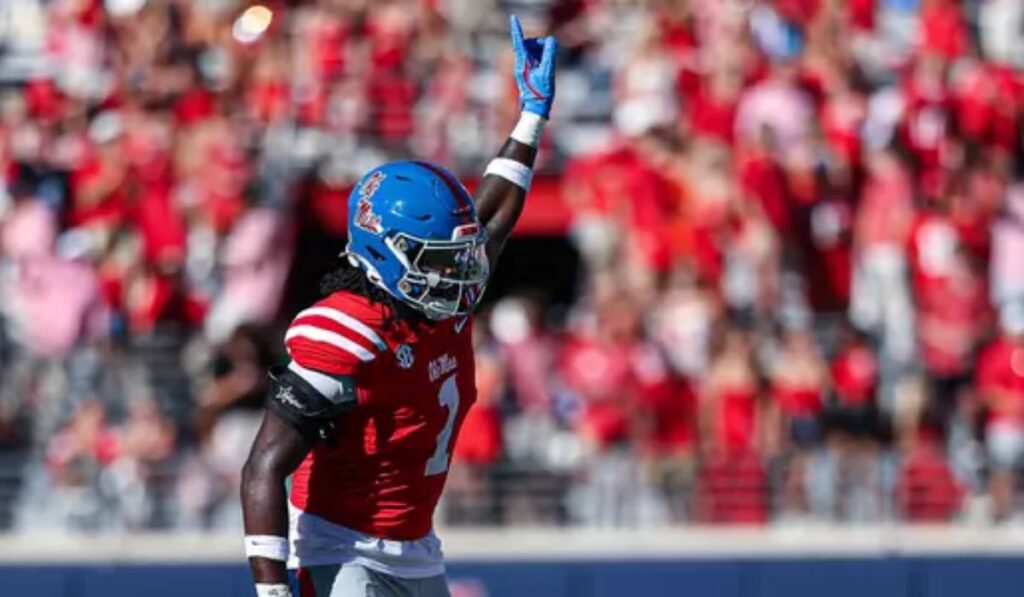 Princely Umanmielen in Ole Miss uniform rushing the quarterback