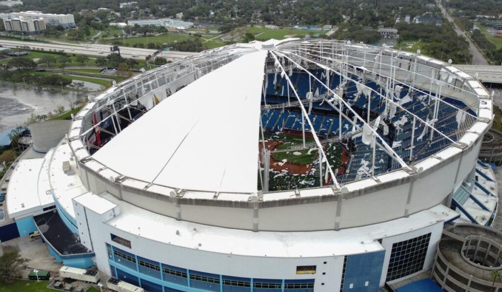 Aerial view of Tropicana Field with extensive roof damage caused by Hurricane Milton