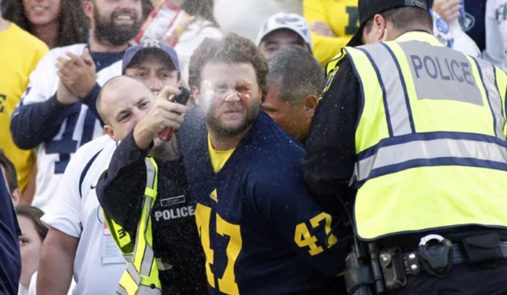 Police Use Pepper Spray to Disperse Brawl Following Michigan's Upset