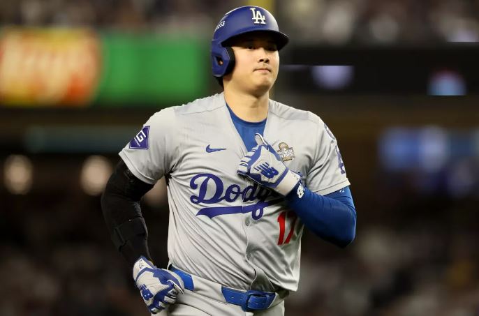 An image of Shohei Ohtani, the two-way baseball superstar, with a concerned expression, highlighting the latest injury update regarding his shoulder surgery.